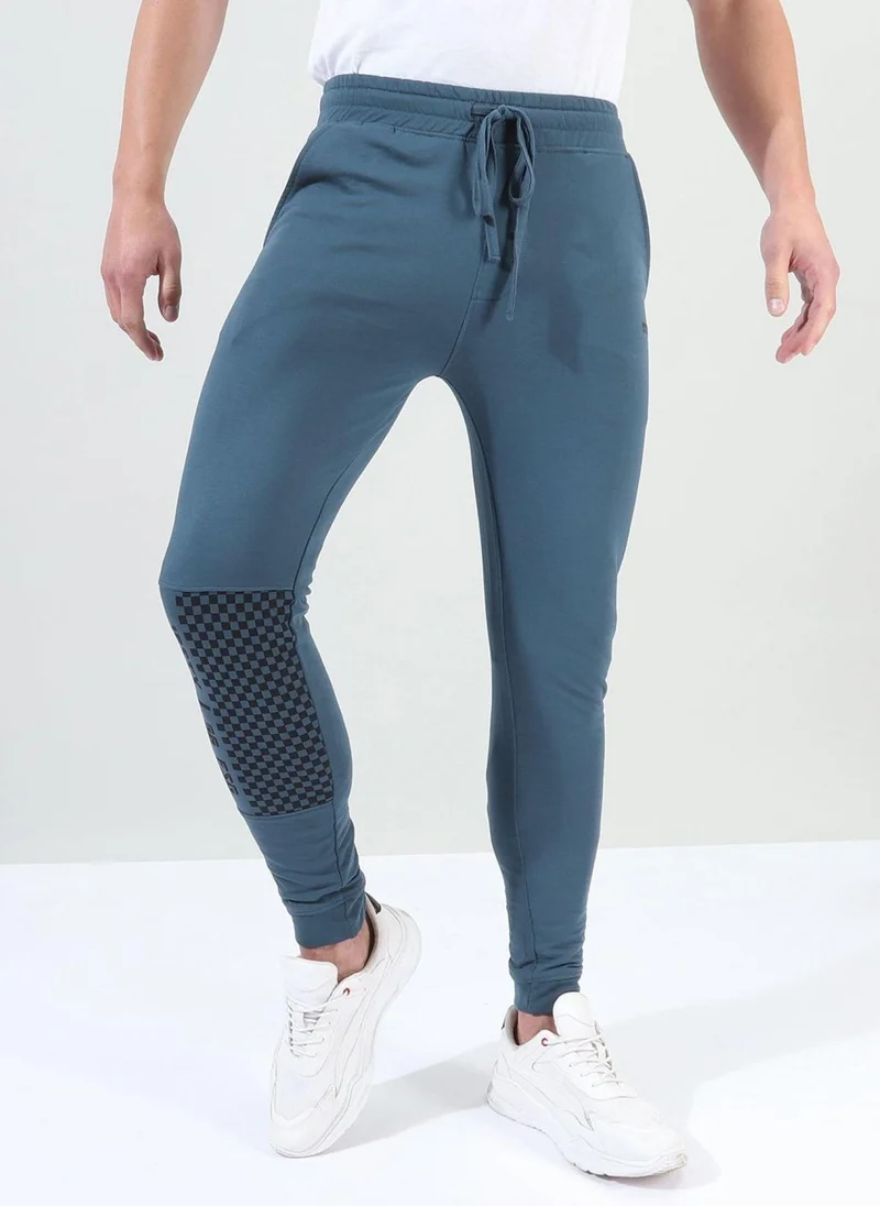 The Indian Garage Co Men Slim Fit Solid Mid-Rise Stretchable Knitted Jogger Trousers