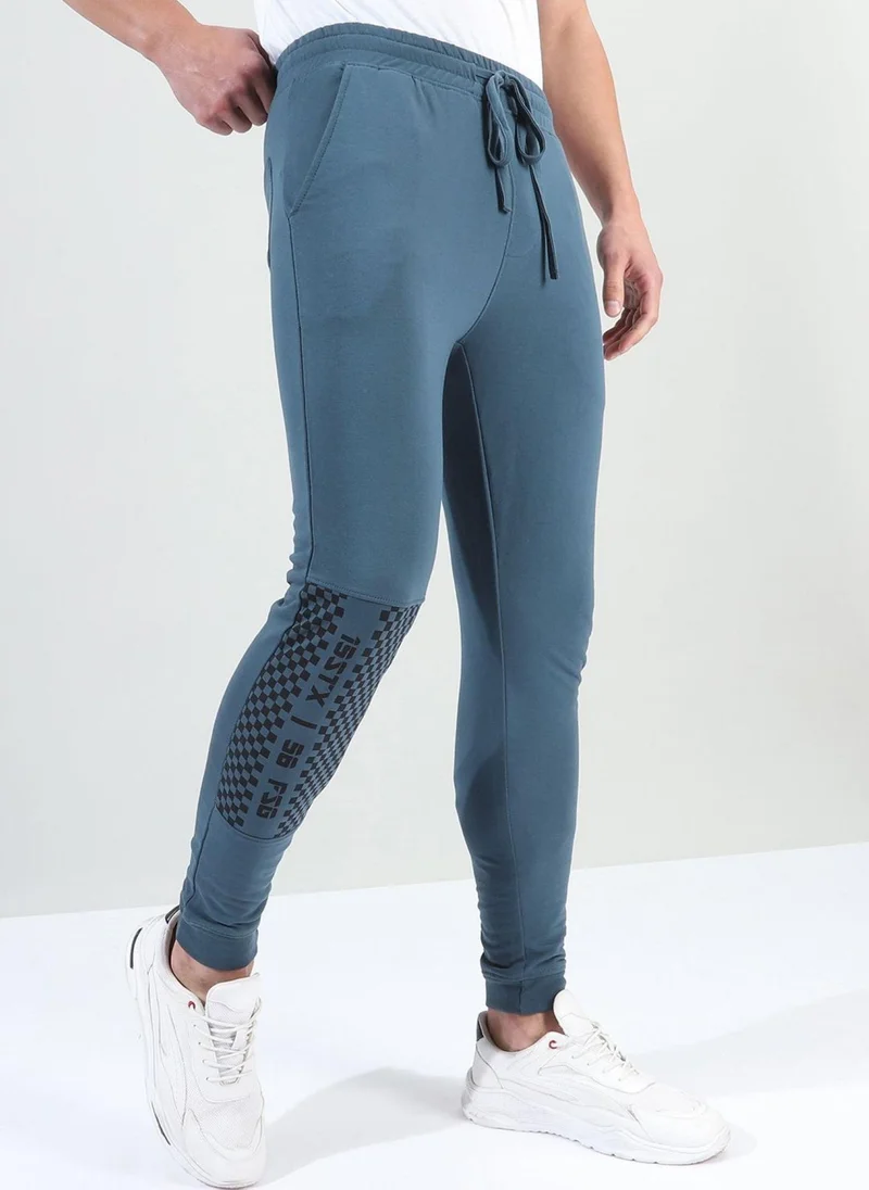 The Indian Garage Co Men Slim Fit Solid Mid-Rise Stretchable Knitted Jogger Trousers