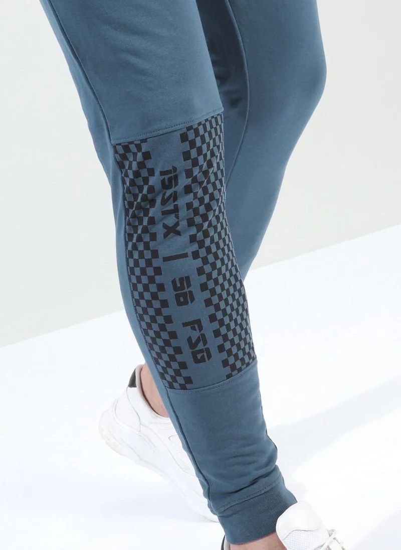The Indian Garage Co Men Slim Fit Solid Mid-Rise Stretchable Knitted Jogger Trousers