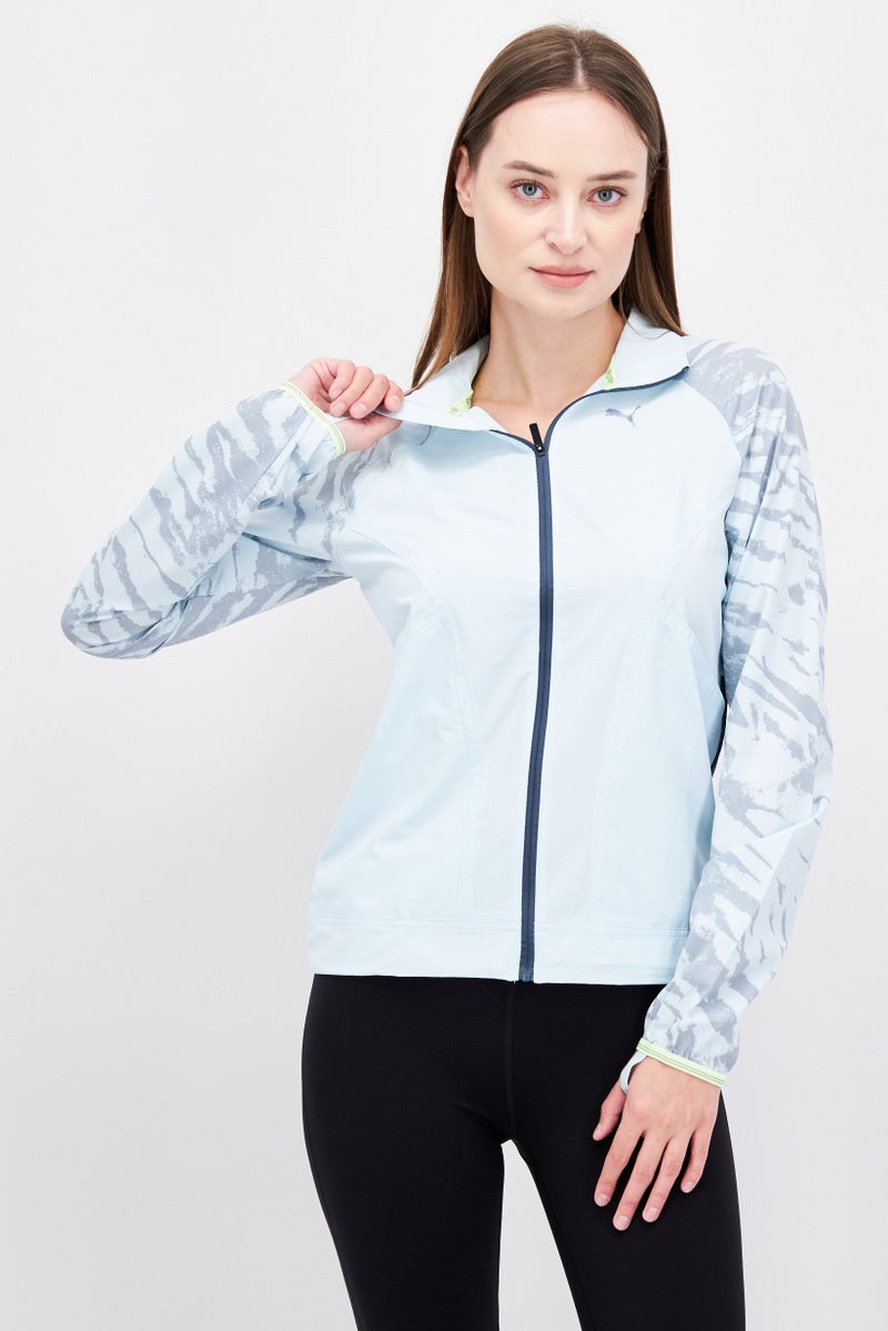 PUMA جاكيت واقي من الرياح للنساء، لون أزرق فاتح - Image 1
