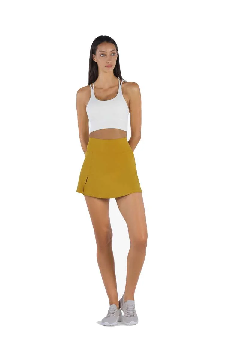 ياسيكو YesEco Women’s Activewear Set – Green Padded Criss-Cross Sports Bra & High-Waist Flared Skirt with Built-In Shorts – Sustainable Recycled Nylon & Spandex Outfit for Yoga, Tennis, or Casual Wear