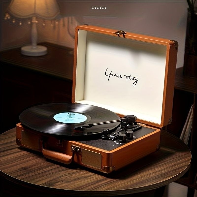 Years stay This Portable Retro Vinyl Record Player Combines a High-quality Phonograph with Bluetooth Functionality. Featuring Bluetooth Connectivity, Vinyl and Cellophane Disc Playback, Headphone Compatibility, and AUX Input Support, It's the Perfect Gift - Image 1