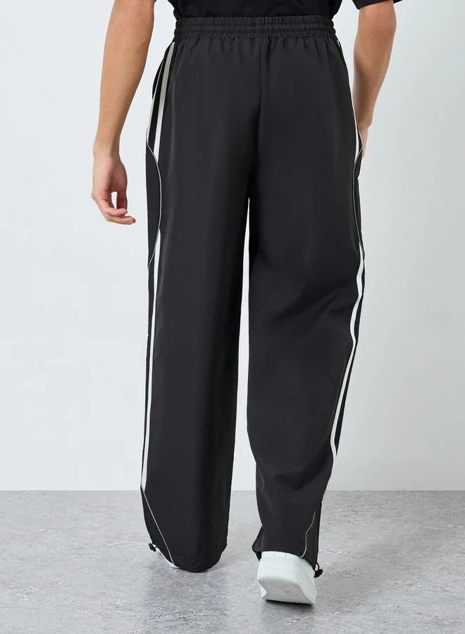 Styli Black Cut and Sew Panel With Striped Detail Joggers for Men | Best Price UAE