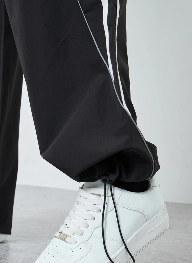 Styli Black Cut and Sew Panel With Striped Detail Joggers for Men | Best Price UAE