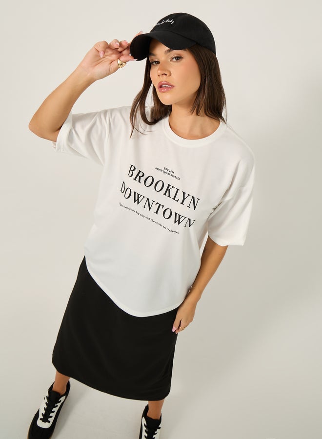 Styli Oversized Slogan Print T-Shirt and Midi Skirt Co-Ords  - Image 1