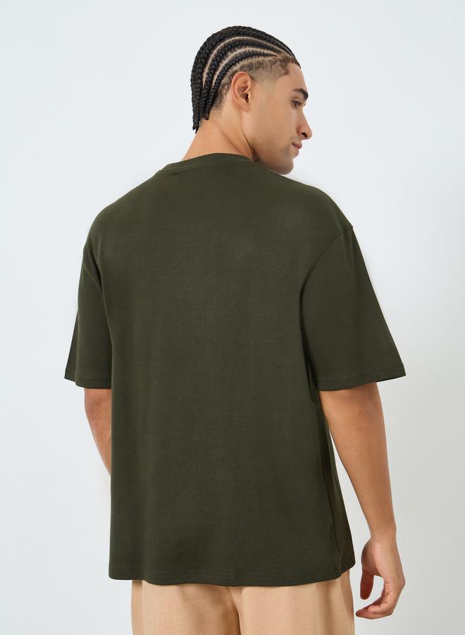 Styli Men Olive Graphic Embossed Oversized T-Shirt - Image 5