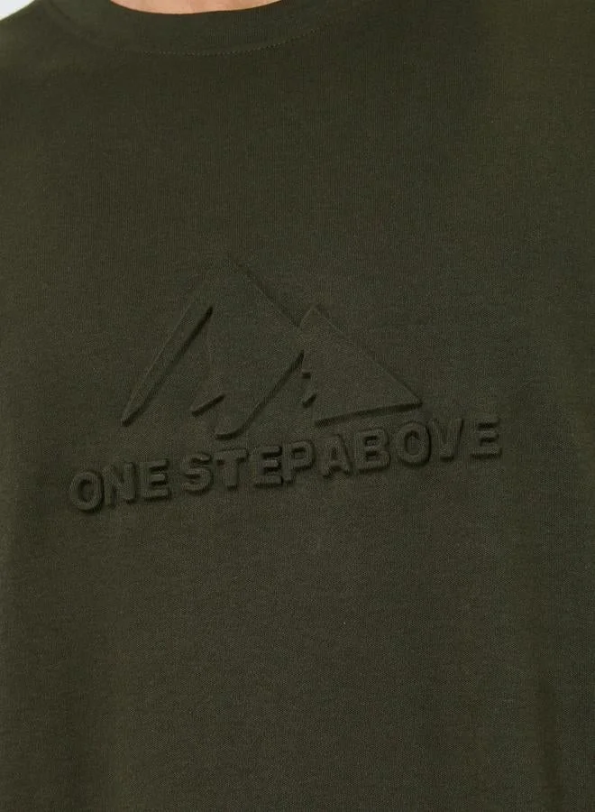 Styli  Men Olive Graphic Embossed Oversized T-Shirt for Men | Best Price UAE