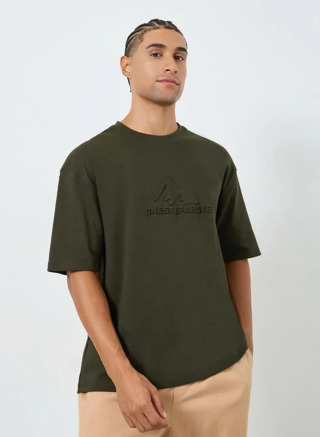 Styli  Men Olive Graphic Embossed Oversized T-Shirt for Men | Best Price UAE