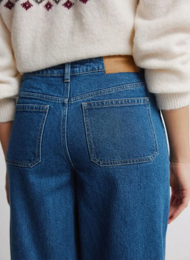 Springfield  High-waisted jeans with front and back patch pockets, front buttons fastening , and a very wide, straight leg. These jeans feature a washing process using cutting-edge technologies, reducing water, chemical, and energy consumption. for Women | Best Price UAE