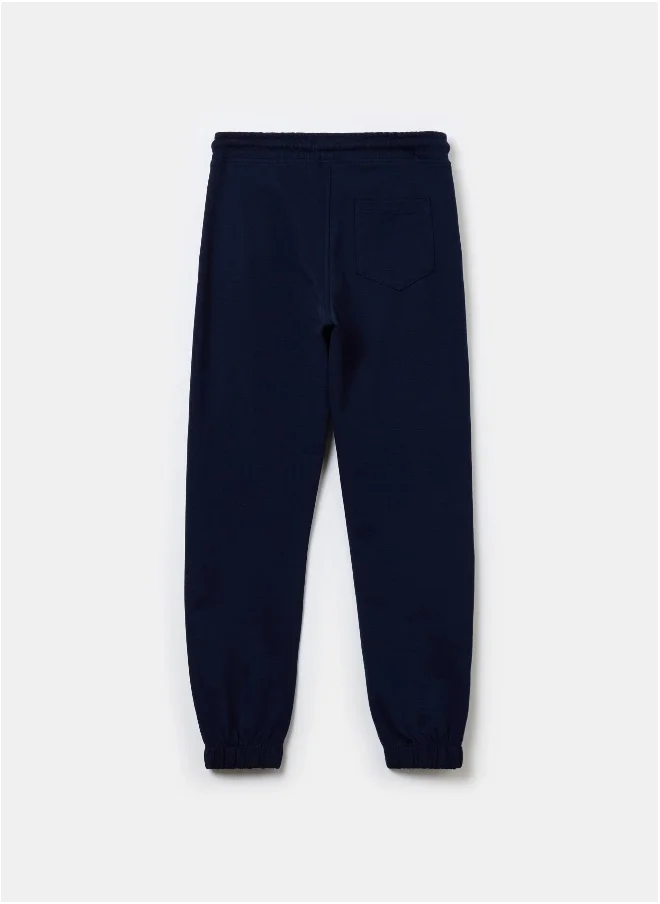 او في اس Solid colour fleece joggers with drawstring