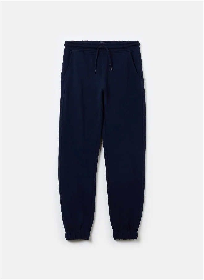 او في اس Solid colour fleece joggers with drawstring