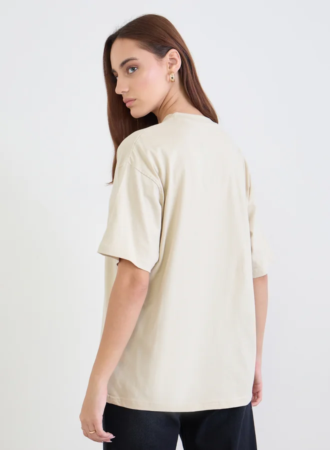 Styli Styli Beige Slogan Print Oversized T-Shirt