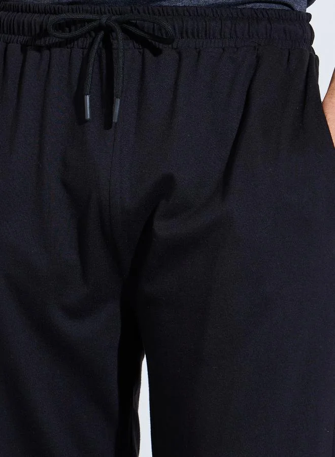 Styli Black Men Black Solid Relaxed Fit Knitted Pants for Men | Best Price UAE