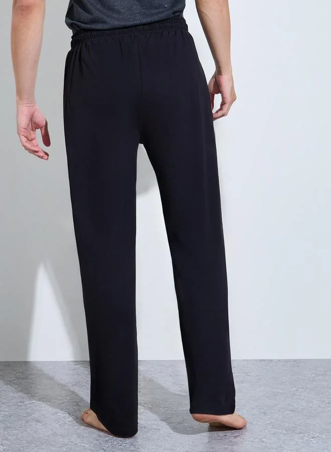 Styli Black Men Black Solid Relaxed Fit Knitted Pants for Men | Best Price UAE