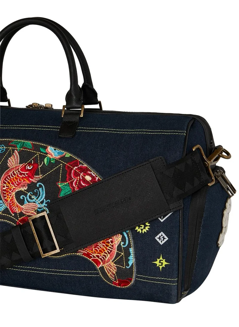 SPRAYGROUND  SG EVISU STYLE DUFFLE  | Best Price UAE