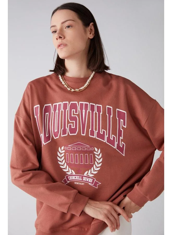 GRIMELANGE Ramona Women's Oversized Soft Fleece Lined Organic Cotton Printed Crew Neck Brick-Red Sweatshirt.