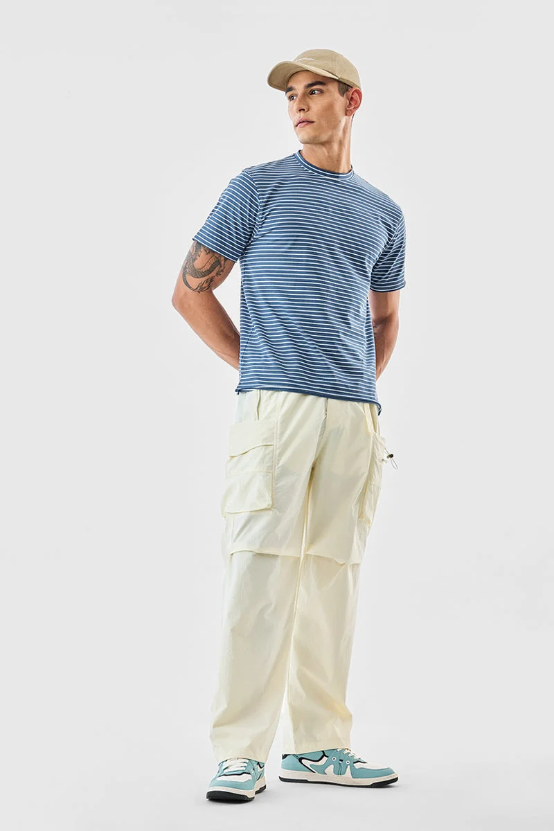 SNITCH بنطلون كارغو بقصة عادية بلون أوف وايت