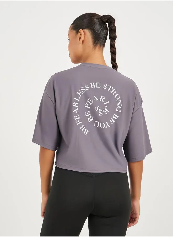 Styli Infinity Swirl Slogan Print Boxy Fit Top with Dropped Shoulder