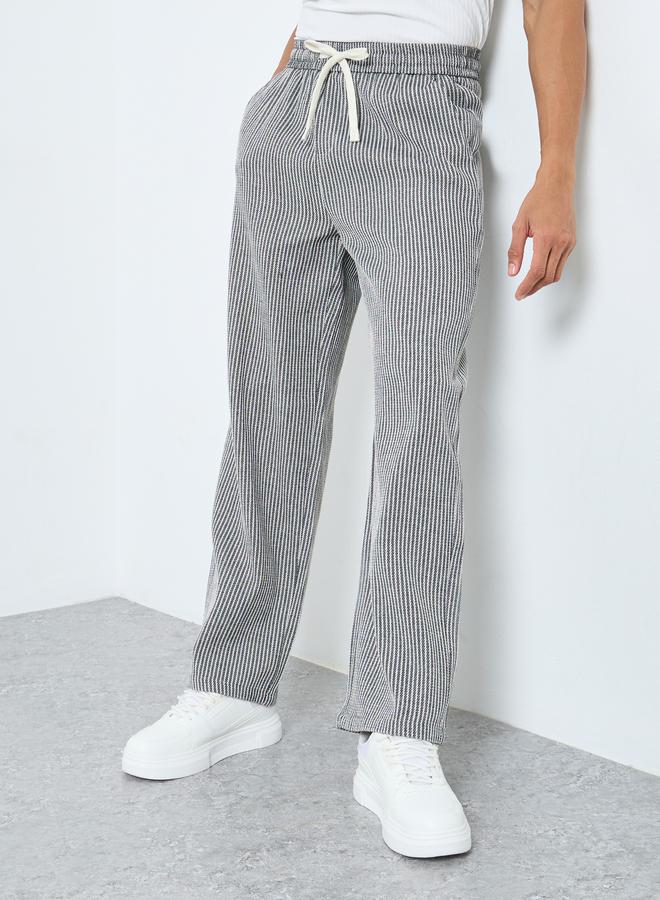 ستايلي بنطلون رياضي رجالي رمادي مخطط واسع - Image 1