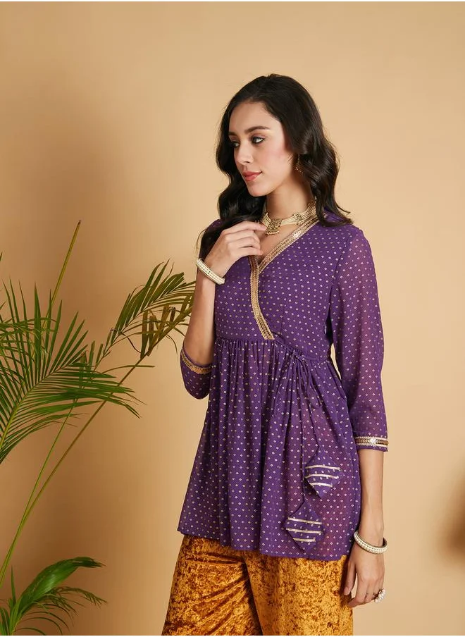 SASSAFRAS Spot Foil Print Lace Trim Wrap Peplum Top by Styli