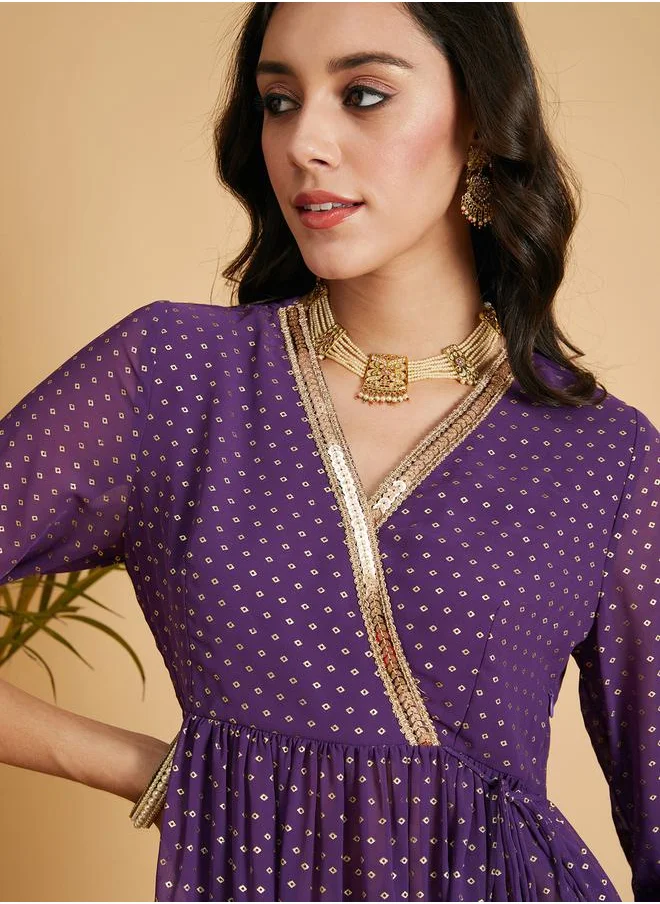 SASSAFRAS Spot Foil Print Lace Trim Wrap Peplum Top by Styli