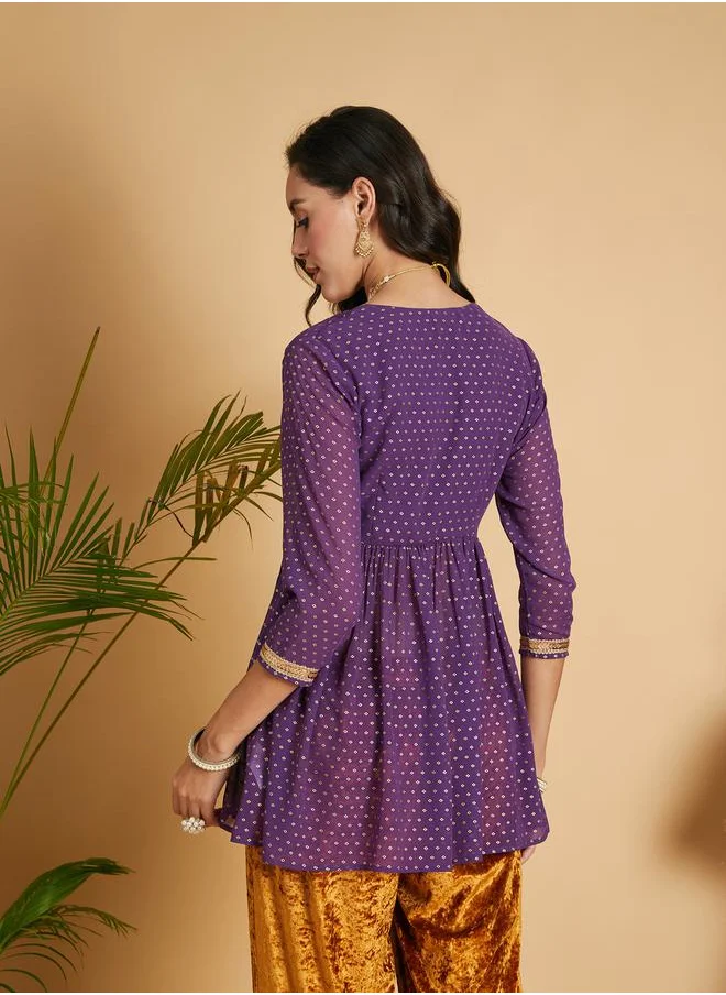 SASSAFRAS Spot Foil Print Lace Trim Wrap Peplum Top by Styli