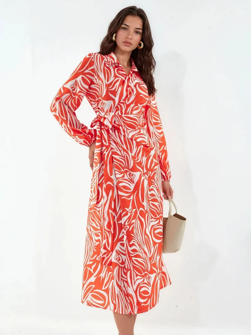 جينيفر Abstract Print Midi Wrap Dress