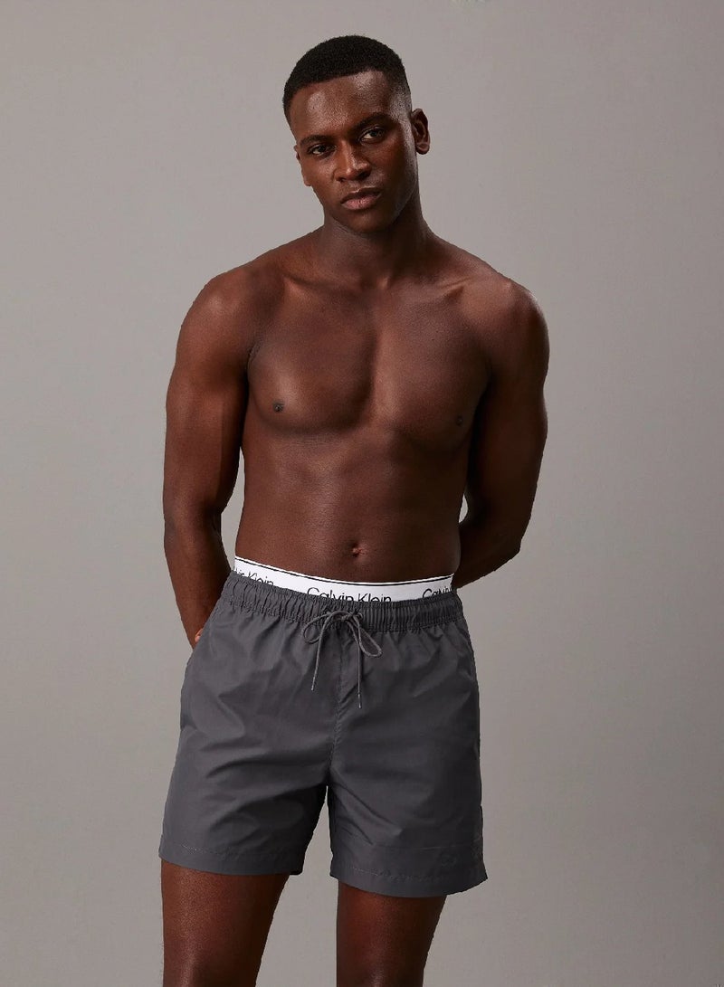 كالفن كلاين شورت سباحة بحزام خصر مزدوج - Image 1