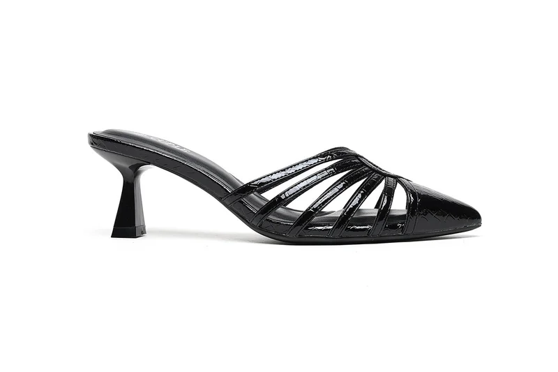 Mid heel mule with angular cutouts