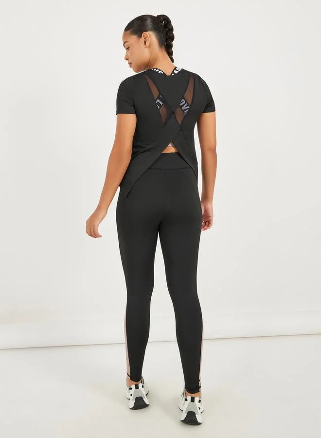 Styli Pack of 3 - Back Dual Mesh Panel Detail Split Hem Top, Taping Detail Sports Bra & Color Block Leggings Set