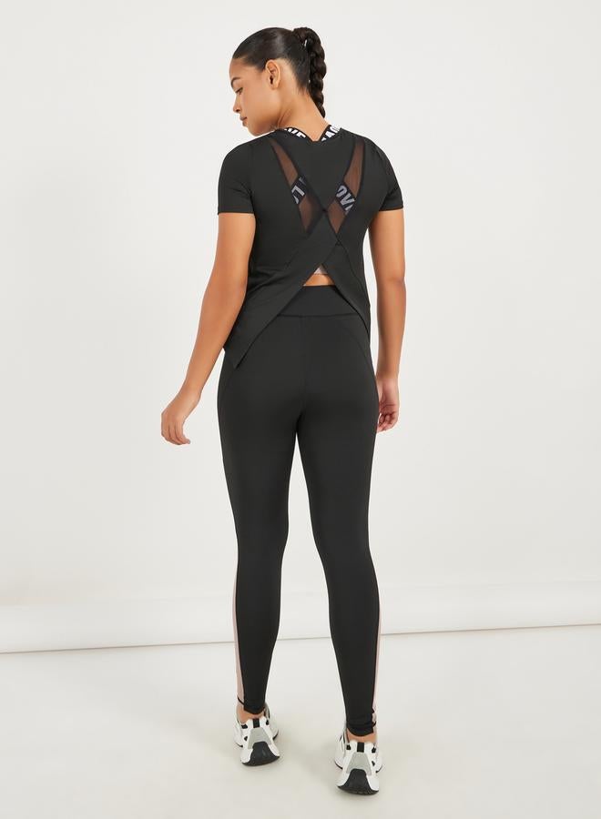 Styli Pack of 3 - Back Dual Mesh Panel Detail Split Hem Top, Taping Detail Sports Bra & Color Block Leggings Set - Image 3