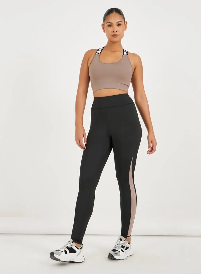 Styli Pack of 3 - Back Dual Mesh Panel Detail Split Hem Top, Taping Detail Sports Bra & Color Block Leggings Set