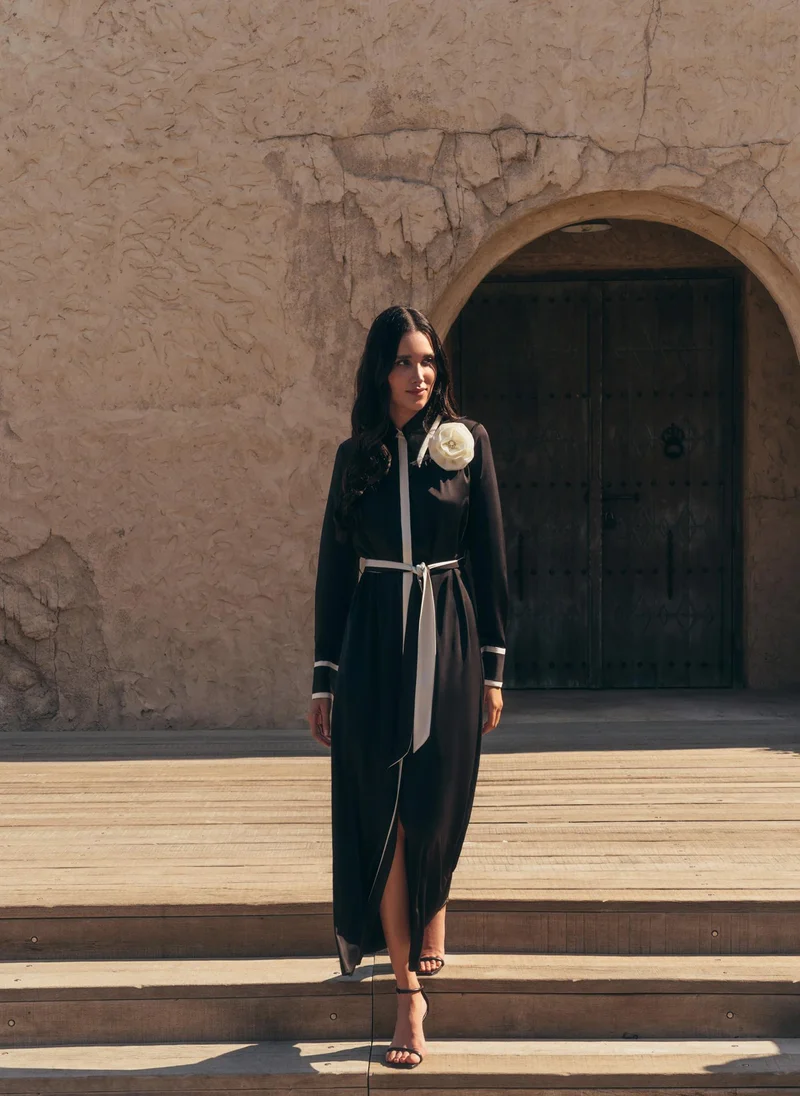 Lichi Maxi dress with contrasting inserts and flower brooch