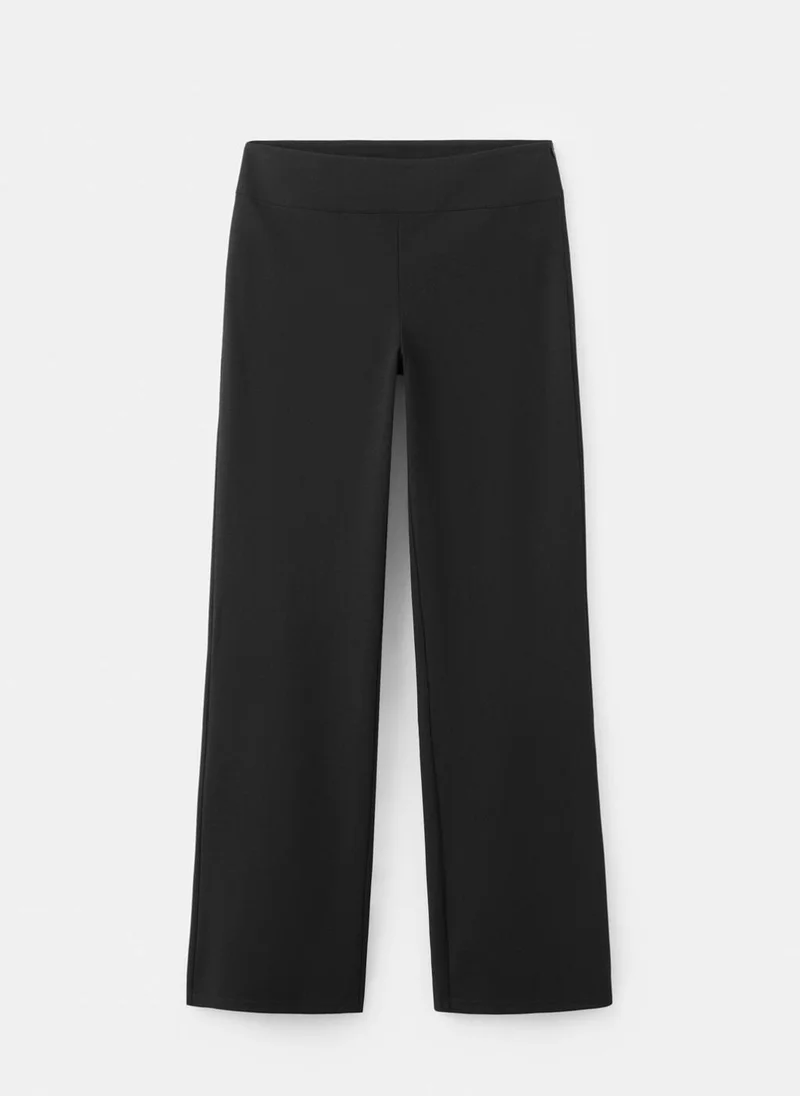 MANGO  Mid-rise flare trousers for Women | Best Price UAE