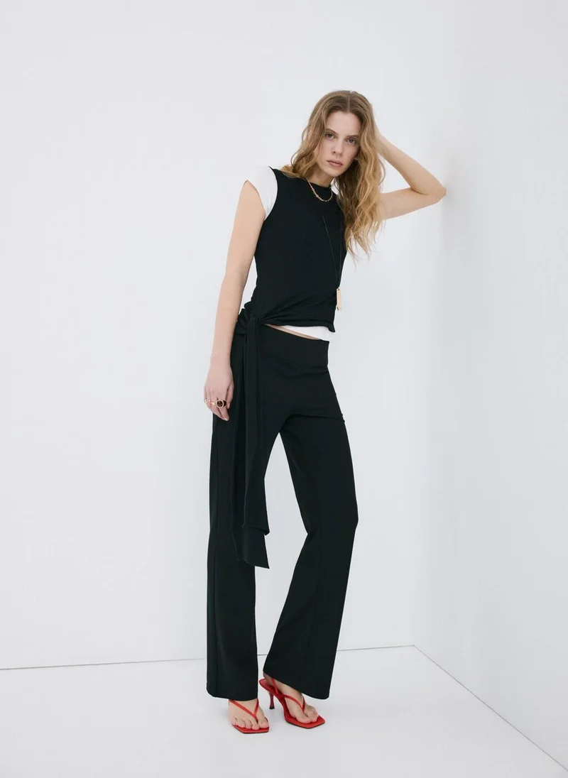 MANGO  Mid-rise flare trousers for Women | Best Price UAE