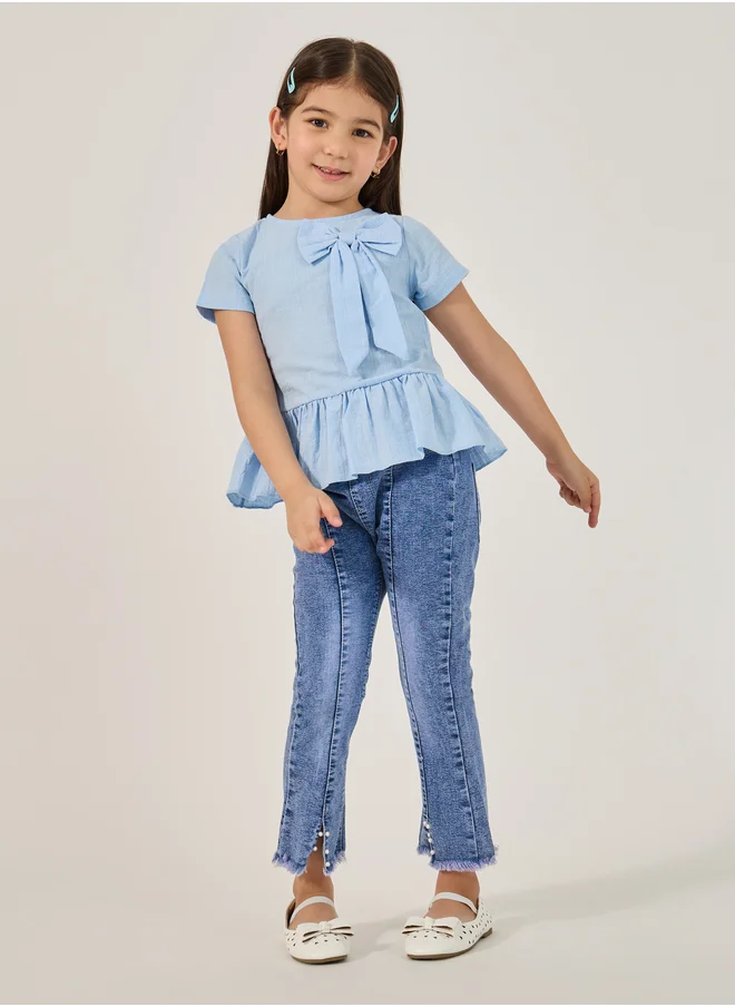 ستايلي Styli Solid Ruffled Hem Top with Bow Detail