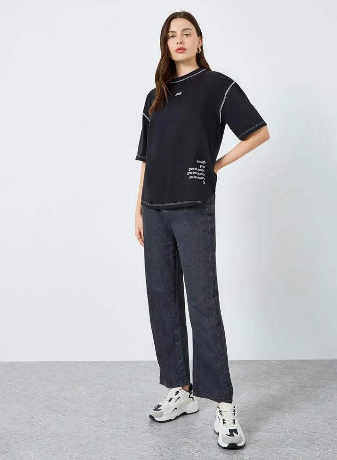 Styli Women Black Oversized Graphic Slogan T-Shirt