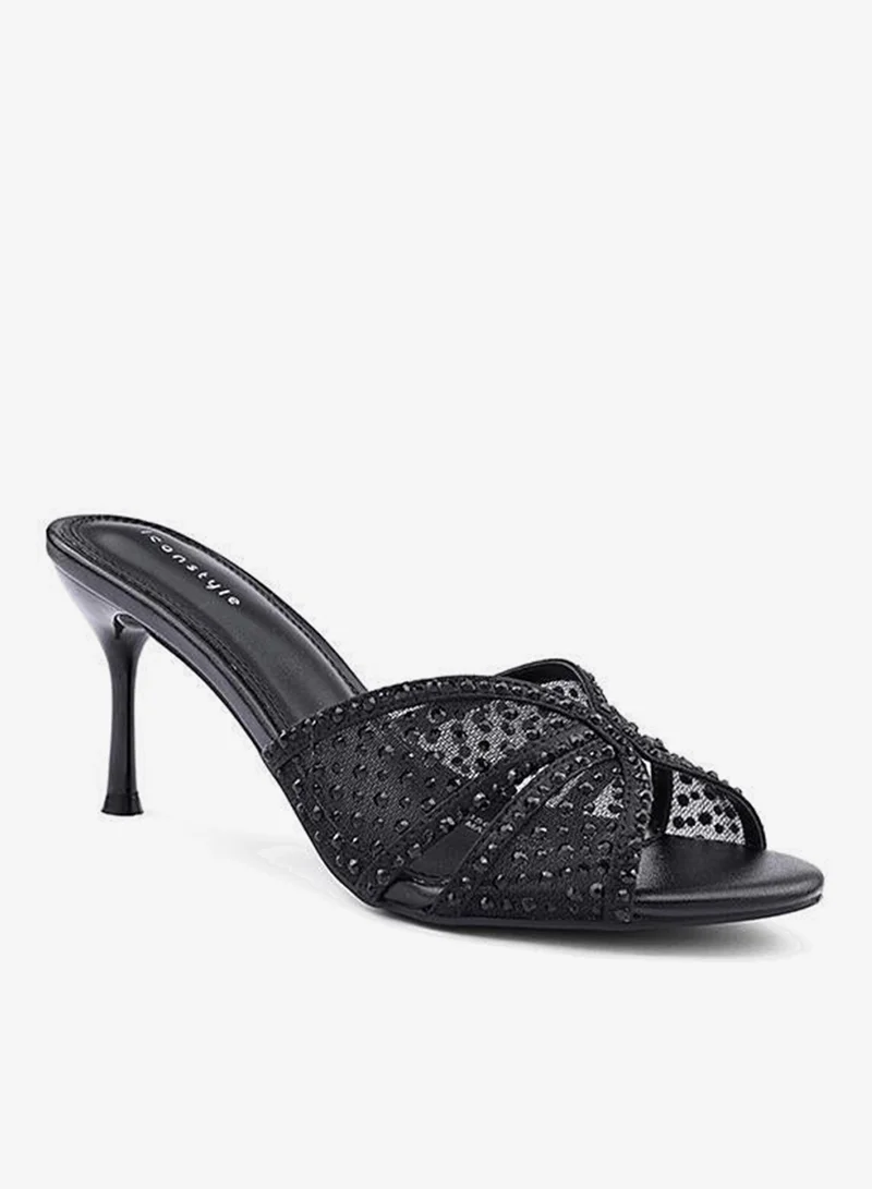 أيقون صنادل بكعب عالي مزينة بأشرطة