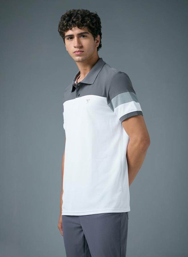 تكنوسبورت بولو بيكيه بقصة ضيقة ونمط كتل الالوان - Image 3