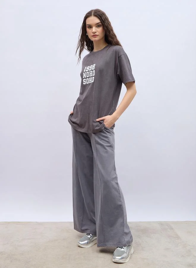 Styli Slogan Print Acid Washed Longline Oversized T-Shirt
