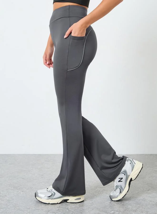 ستايلي اكتيف ليقنز واسع بأشرطة عاكسة مع تفاصيل جيب