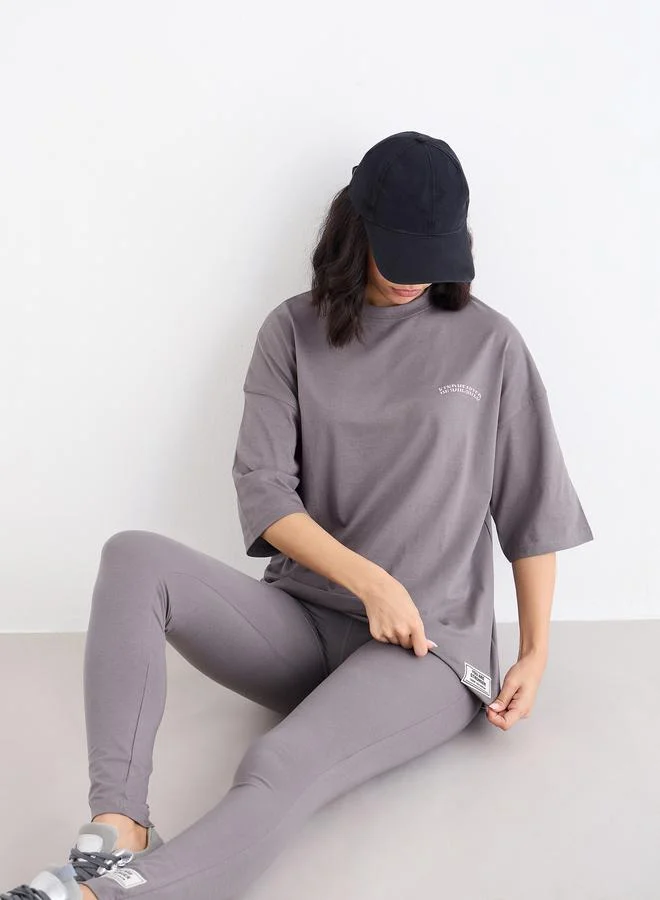 Styli  Styli Oversized Slogan T-Shirt and Badge Detail Leggings Co-Ords for Women | Best Price UAE