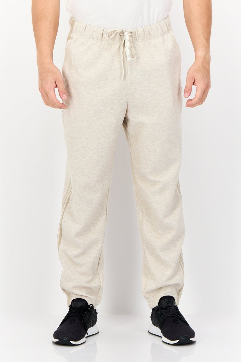 adidas Originals Men Sportswear Fit Brand Logo Outdoor Sweatpants, Beige  - Image 1
