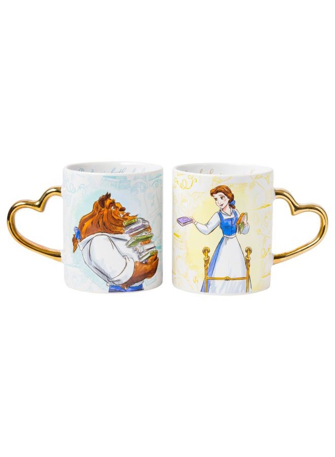 Silver Buffalo Disney Princess Beauty and the Beast Don't Mind the Books Gold Heart Shaped Handle 2 Pack Ceramic Mug Set, 14 Ounces - Image 1