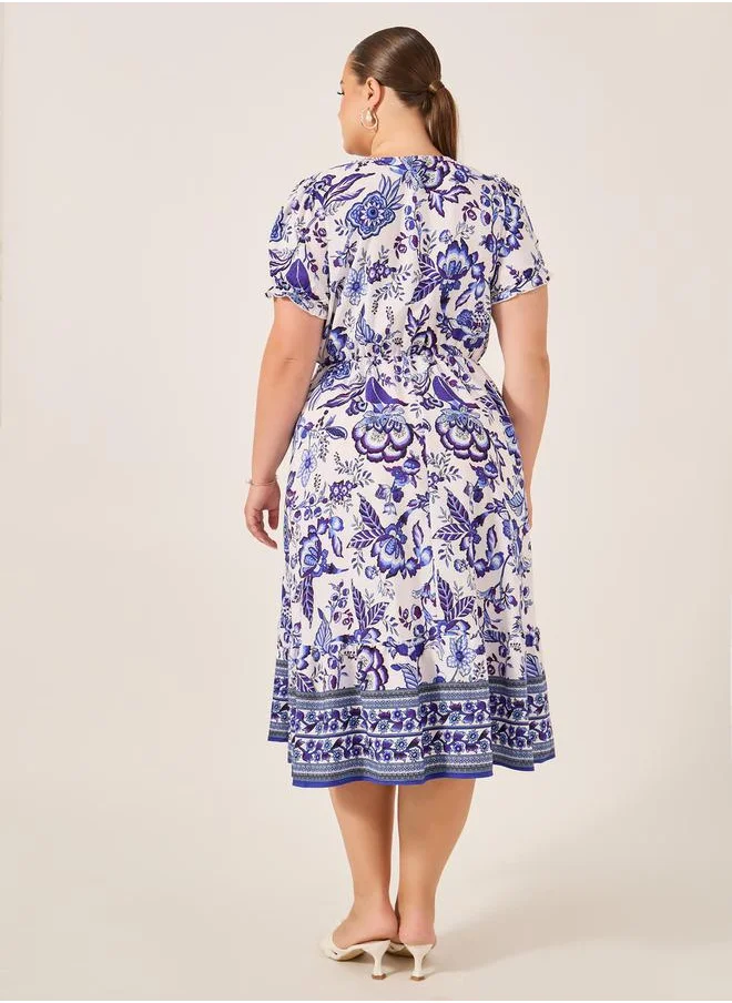 Styli Plus Size All-Over Printed Wrap Look A-Line Midi Dress
