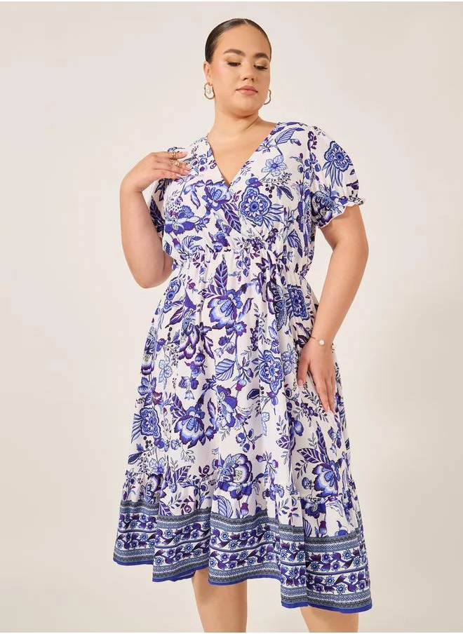 Styli Plus Size All-Over Printed Wrap Look A-Line Midi Dress
