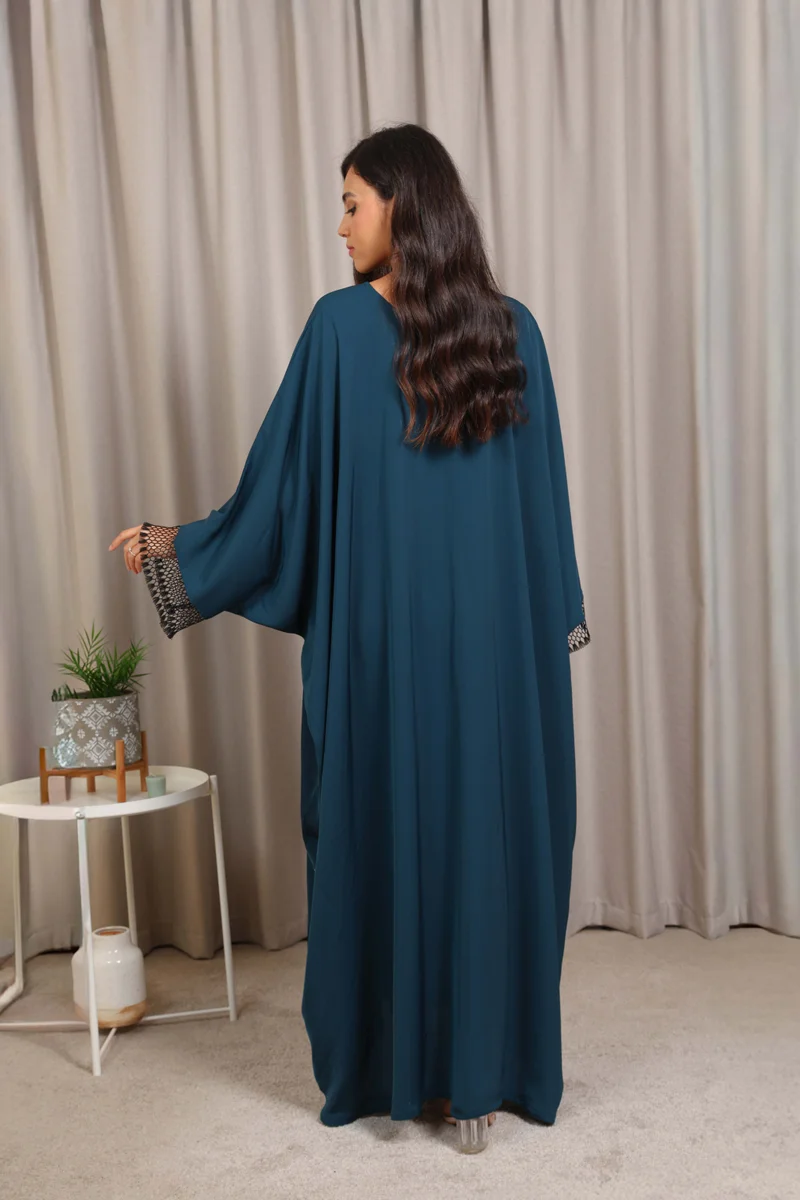 Nikias  Nikias Turquoise Nida Butterfly Abaya – Elegant Flowing Design for Women | Best Price UAE