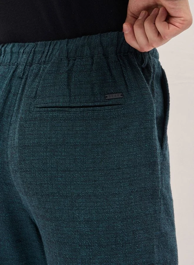 The Bear House  Men's Teal Self Design Tapered Fit Elasticated Waist Casual Trouser Versatile Office and Travel Pants Comfortable Fit for Everyday Use Easy to Style Bottomwear for Work Weekend and Outings for Men | Best Price UAE