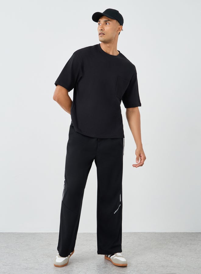Styli Men Black Interlock Oversized T-Shirt with Pocket - Image 2