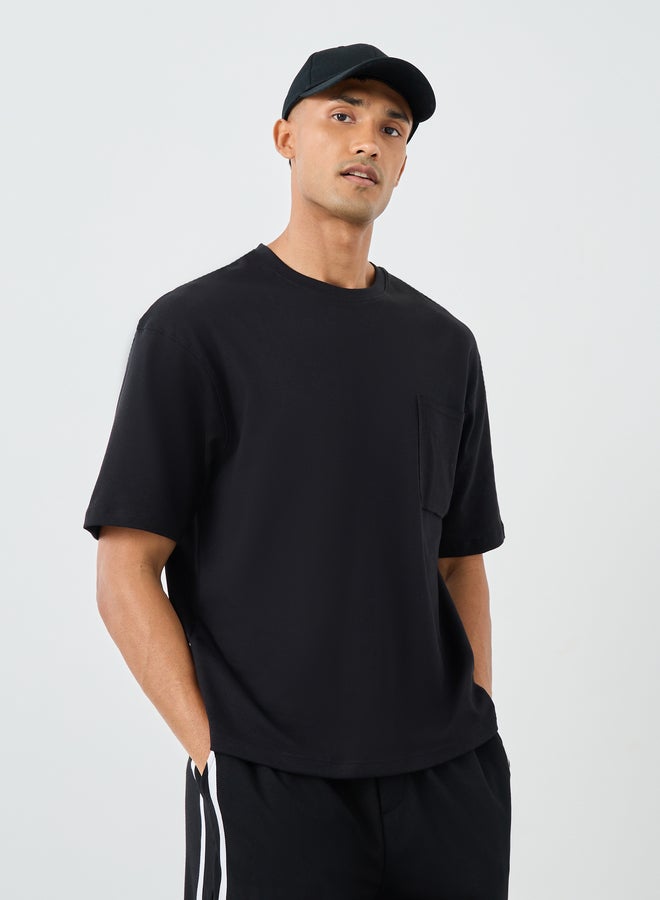 Styli Men Black Interlock Oversized T-Shirt with Pocket - Image 1